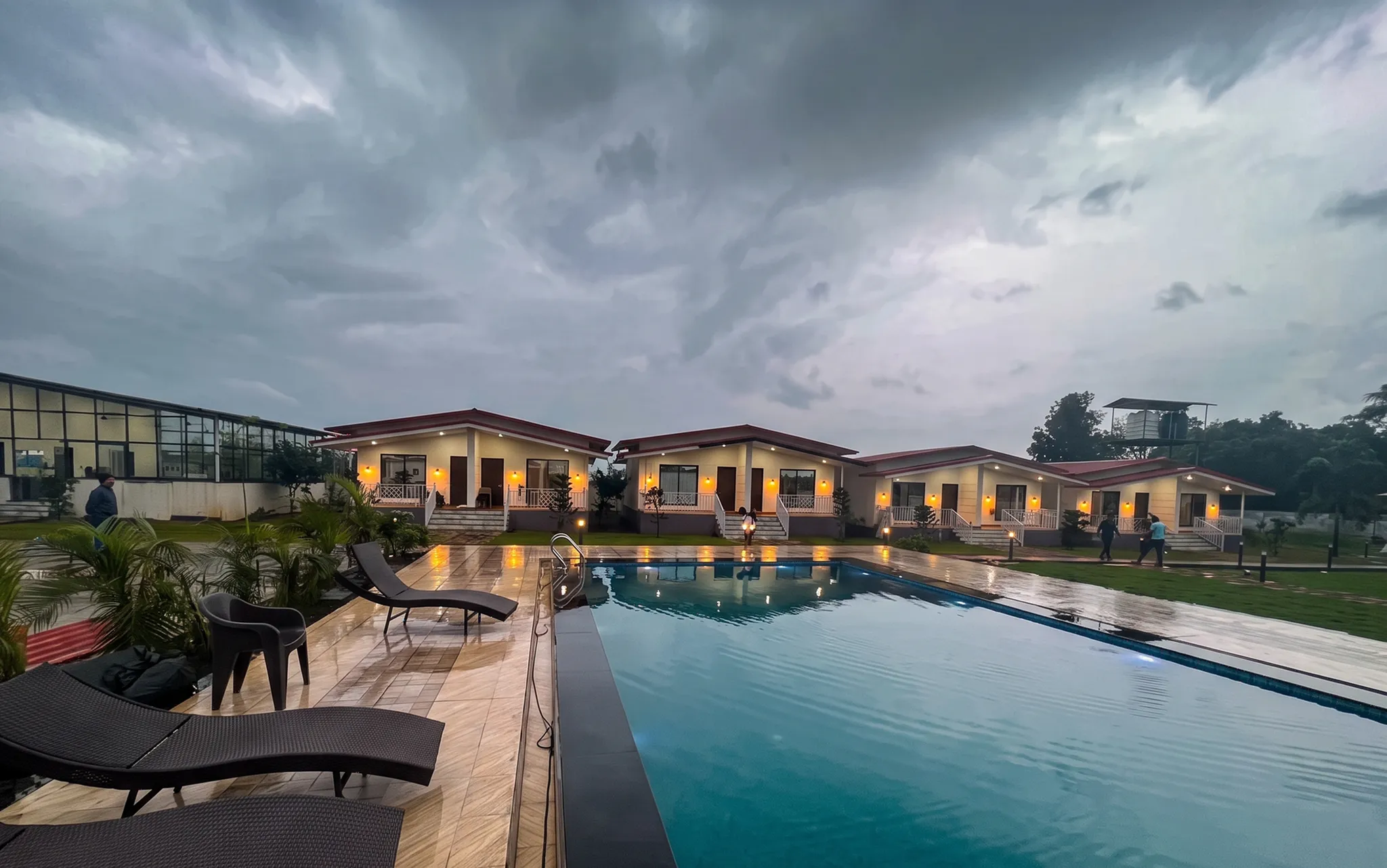 Outdoor swimming pool with hotel exterior